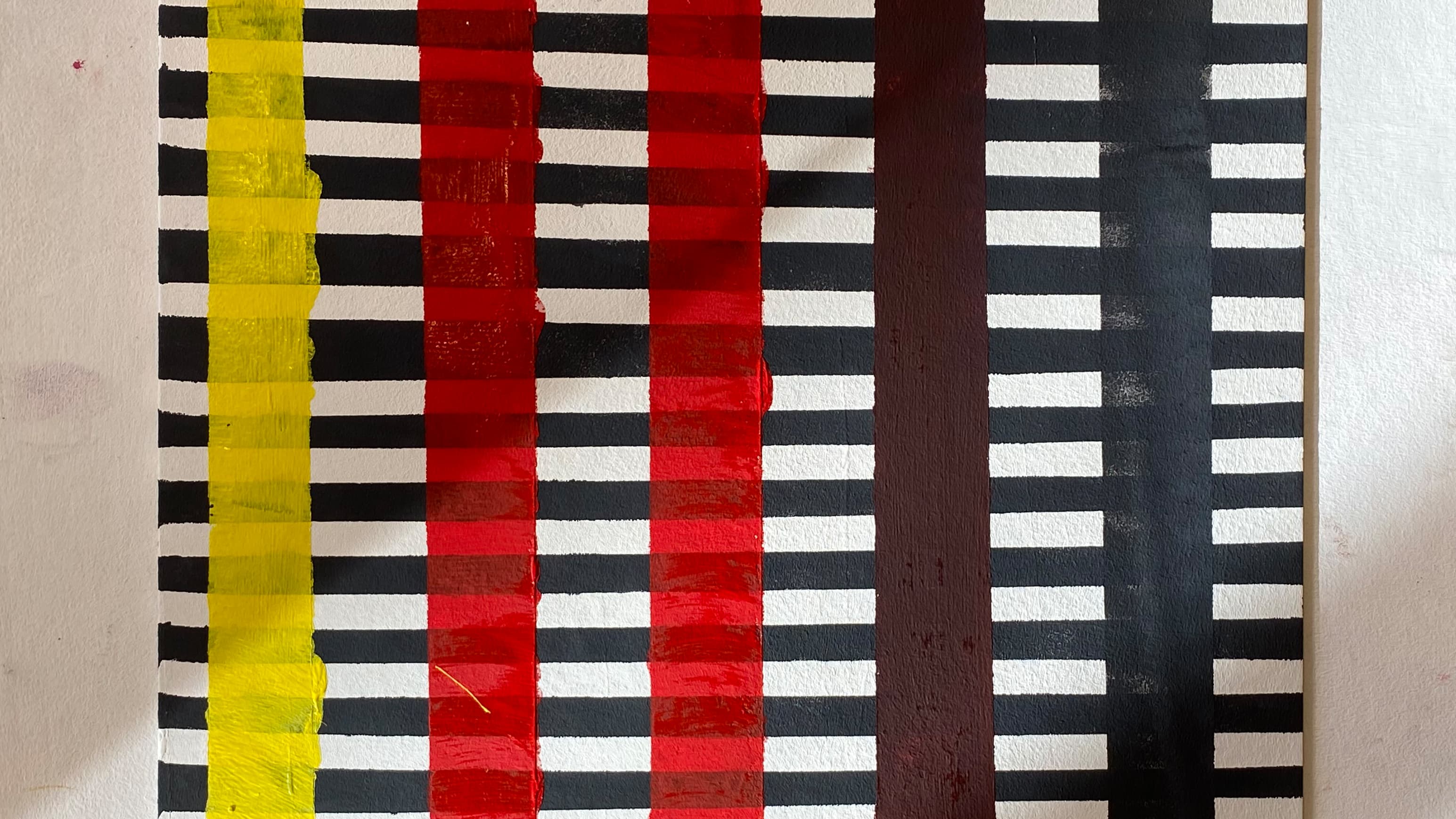 Ein selbstgestaltetes Kunstwerk mit einem Raster in Gelb-, Rot- und Grautönen