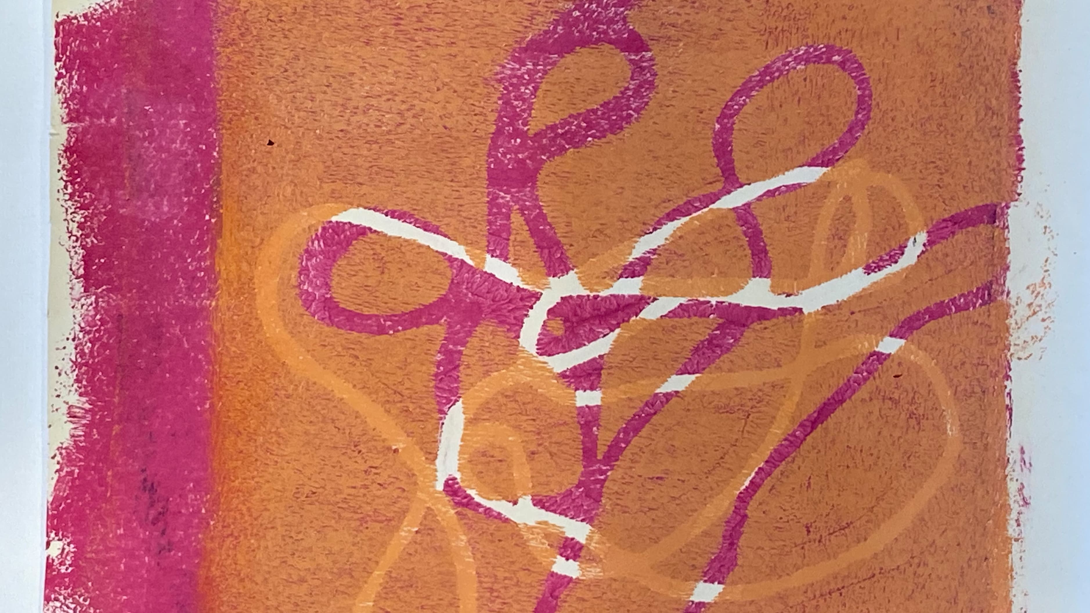 Ein gedrucktes Werk in Orange und Magenta, ein Abdruck einer Schnur.
